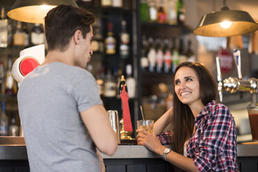 Young couple talking at bar - CUF22269