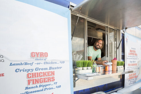 Portrait of man in fast food trailer - ISF08292