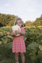 Portrait of young girl, holding pumpkin - ISF08324