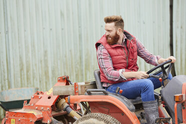Man on farm driving tractor - CUF22787