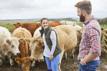 Young couple on cow farm - CUF22794