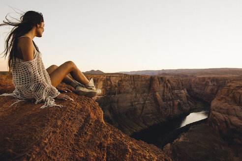 Woman relaxing and enjoying view, Horseshoe Bend, Page, Arizona, USA - ISF08764