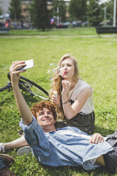 Couple taking selfie in park - CUF22822