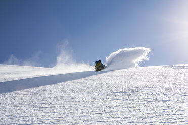 Man snowboarding down steep mountain, Trient, Swiss Alps, Switzerland - CUF23033