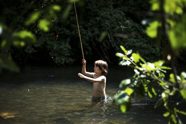 Boy casting fishing rod stock image. Image of casting - 22164485