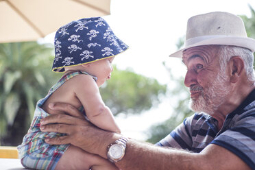 Grandfather making faces at baby boy - CUF23051