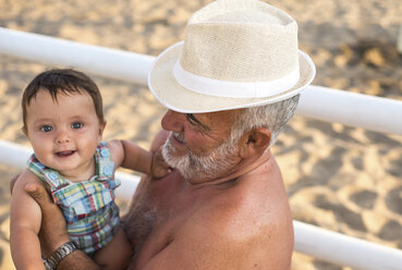 Grandfather holding smiling baby boy - CUF23052