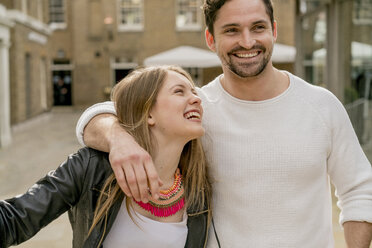 Happy young couple on Kings Road, London, UK - CUF23070