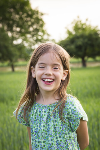 Portrait of happy little girl in nature stock photo