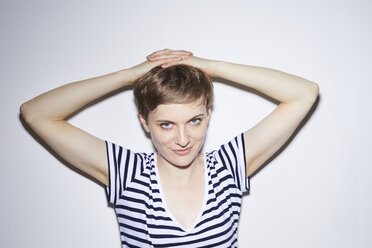 Portrait of blond woman, short hair, hands on head - PNEF00675