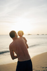 Thailand, Koh Lanta, father playing with his little daughter on the beach - GEMF02056