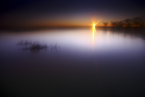 Spain, Castilla y Leon, Province of Zamora, Reserva natural de Lagunas de Villafafila, lake at sunset stock photo