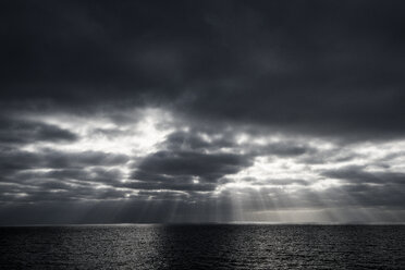 Sunbeams through clouds over sea, Guadalupe Island, Mexico - ISF08858