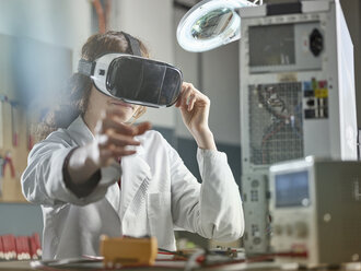 female engineer using virtual reality headset - CVF00702