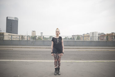 Portrait of young female punk standing on city rooftop - CUF23260