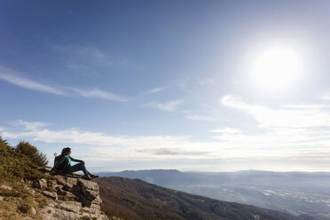 Hiker enjoying view from hilltop, Montseny, Barcelona, Catalonia, Spain - CUF23295