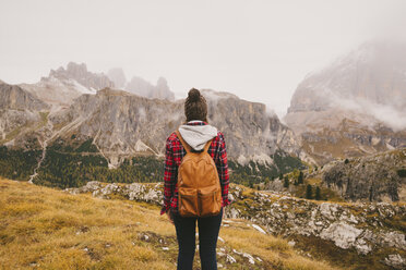 Hiker looking out at Mount Lagazuoi, Dolomite Alps, South Tyrol, Italy - CUF23553