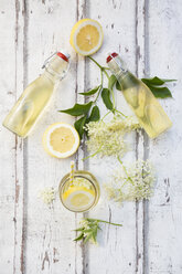 Homemade elderflower sirup, lemon slices, leaves and elderflower - LVF07039