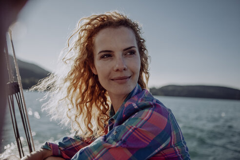 Portrait of confident woman on a sailing boat - JLOF00029