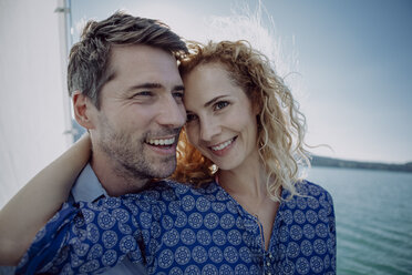 Happy couple on a sailing boat - JLOF00059