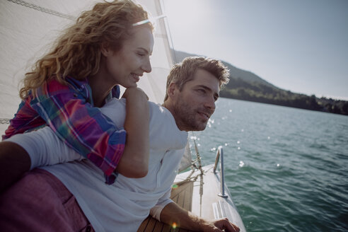 Happy couple on a sailing boat - JLOF00077