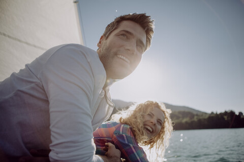 Happy couple on a sailing boat stock photo