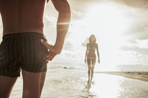 Couple on beach, Ari Atoll, Maldives - CUF23872