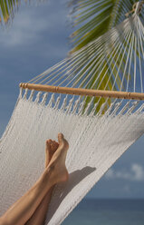 Woman's feet lying in hammock, Ari Atoll, Maldives - CUF23875