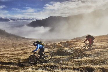 Mature men mountain biking, Valais, Switzerland - CUF23885