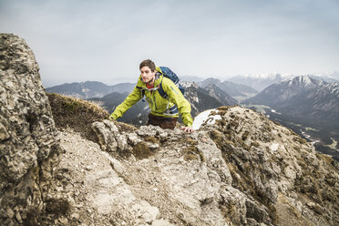 Young male hiker on Klammspitze mountain, Oberammergau, Bavaria, Germany - CUF24102