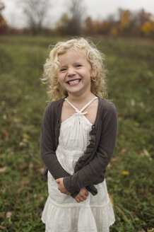 Portrait of young girl smiling, outdoors - CUF24279