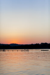Germany, Bavaria, Chiemsee, boardwalk at sunset - MMAF00377