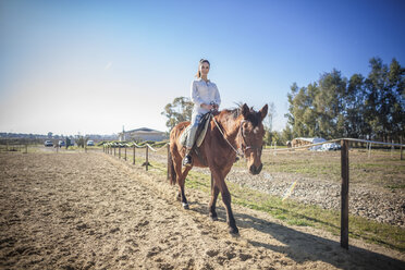 Young woman riding horse - CUF24718