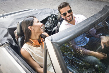Mid adult couple in convertible car, elevated view - CUF24751