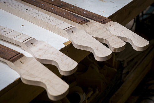 Headstocks and necks of guitars in workshop - ISF09413