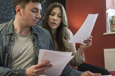 Couple looking at paperwork - CUF25632
