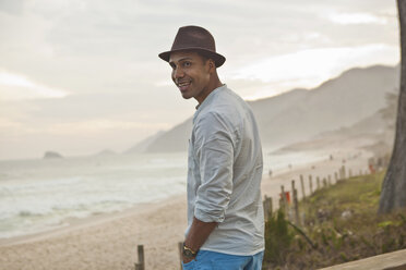 Portrait of mid adult man at beach, Rio De Janeiro, Brazil - CUF27099