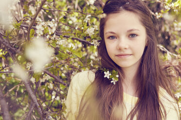 Portrait of pretty girl and tree blossom - CUF27140