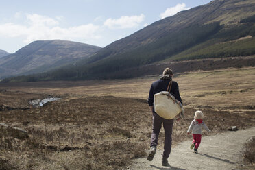 Father and son out hiking, Fairy Pools, Isle of Skye, Hebrides, Scotland - CUF27321