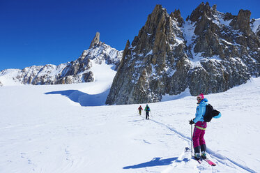 Three skiers on Mont Blanc massif, Graian Alps, France - CUF27493