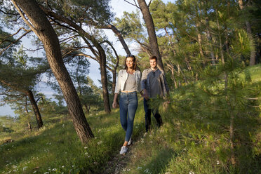 Young couple strolling in coastal forest, Split, Dalmatia, Croatia - CUF27739