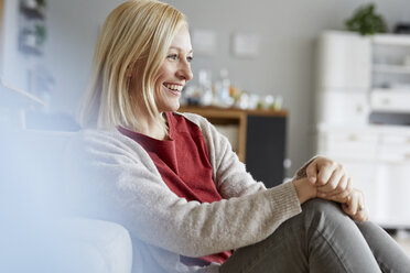 Happy woman relaxing at home - RBF06290