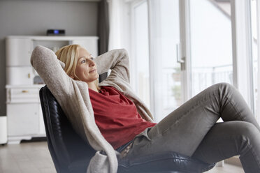 Happy woman relaxing at home - RBF06295