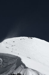 Skiers on mountain in distance, Zermatt, Valais, Switzerland - CUF28263