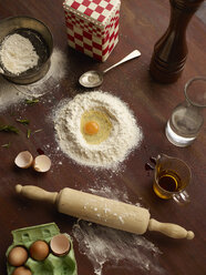 Overhead view of baking preparation with flour and eggs - CUF28384