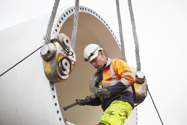 Engineer working on wind turbine - CUF28482