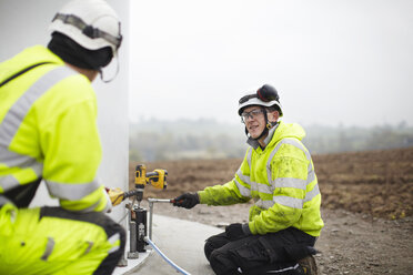 Engineers working on wind turbine - CUF28498