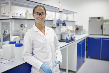 Scientist smiling in laboratory - CUF28668