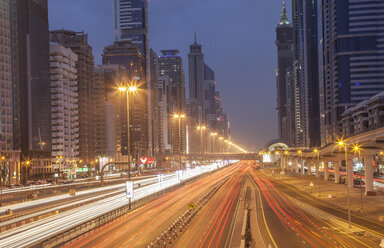 City highway and Dubai metro rail station at night, downtown Dubai, United Arab Emirates - CUF28797