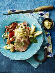 Overhead view of choucroute garnie in blue bowl - CUF29056